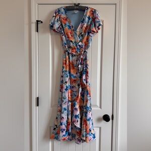 Nicole Miller Size XS pretty floral summer dress.  Sleeveless with ruffled cap.